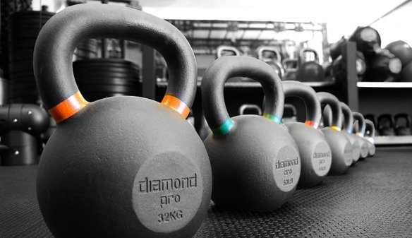 kettlebells lined up in gym of twd fitness personal trainer in daventry for hiit fitness classes